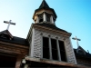 Taking a picture of a burnt church on a blue skied day