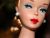 Barbie Contemplates the Concept of Beauty While Sitting on a Tin Can